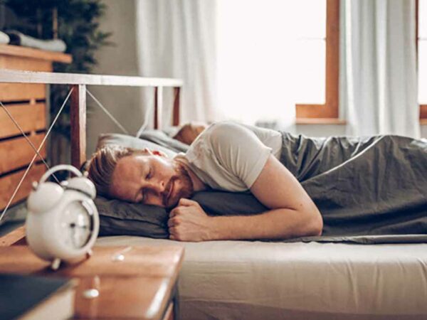 White Man Sleeping In Bed